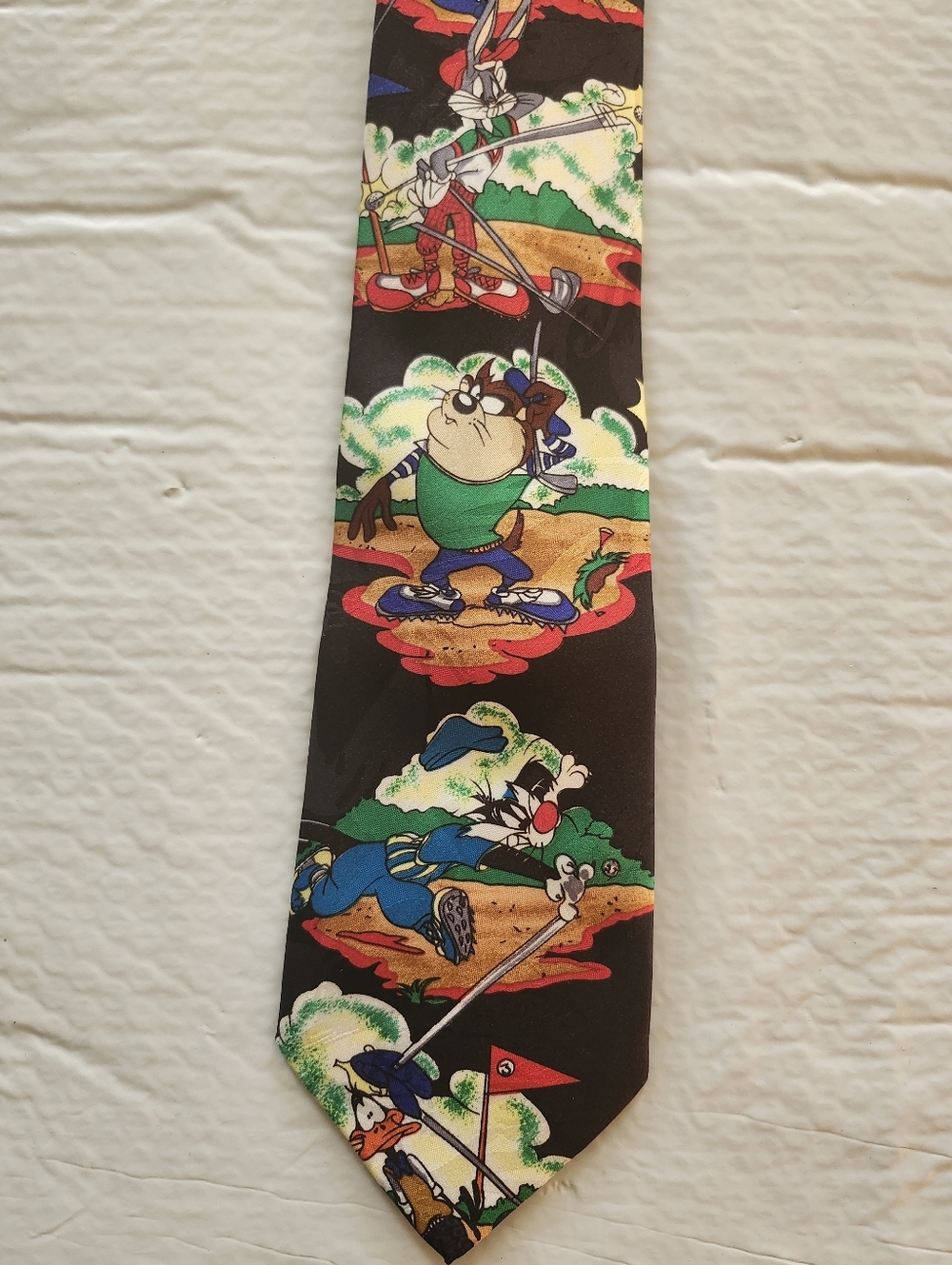 Warner Bros. Looney Tunes Mania Black Novelty Tie with Multi-Color Golf Motif